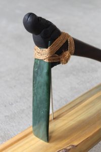 Carved greenstone head of traditional maori adze by Al Brown