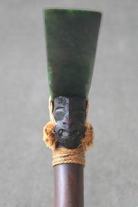 Carved face on traditional Maori adze by Al Brown