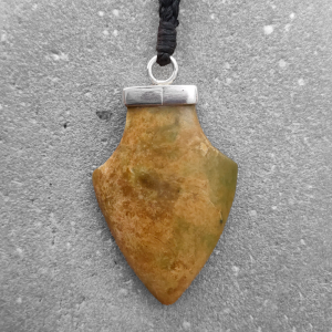 Spearhead pendant carved from yellow green NZ jade, by Ana Krakosky
