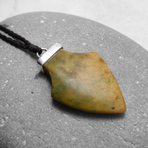 Spearhead pendant carved from yellow green NZ jade, by Ana Krakosky