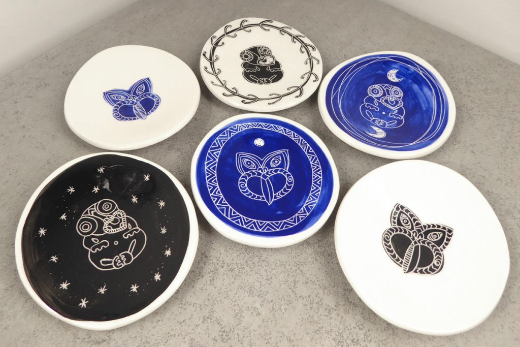 Small ceramic dishes with tiki design, by Borrowed Earth