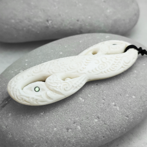 Carved beef bone manaia pendant by Brian Flintoff