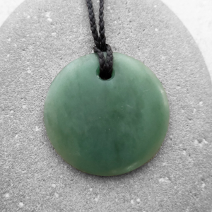 NZ Greenstone taurus disc pendant