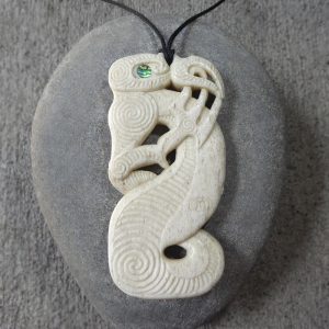 Manaia pendant carved from New Zealand whalebone by Owen Mapp