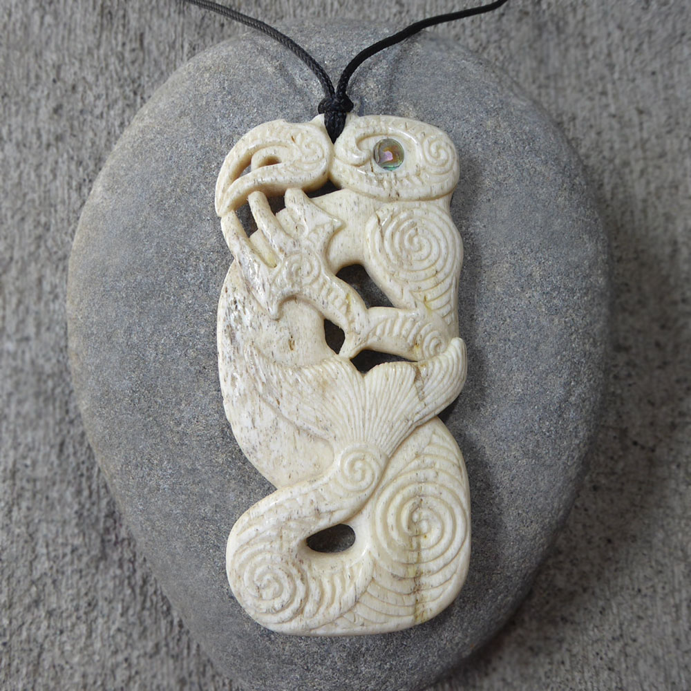 Manaia pendant carved from New Zealand whalebone by Owen Mapp
