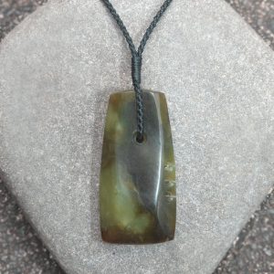 Greenstone adze or toki pendant by Raegan Bregmen