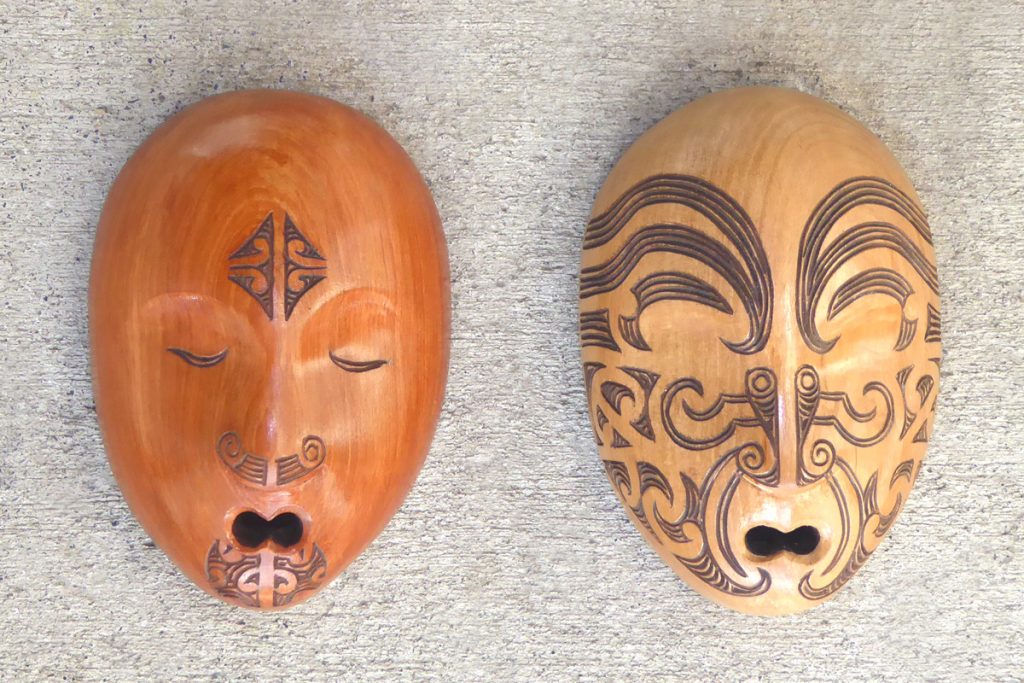 Carved wood masks with maori tattoo/moko by Thomas Hansen