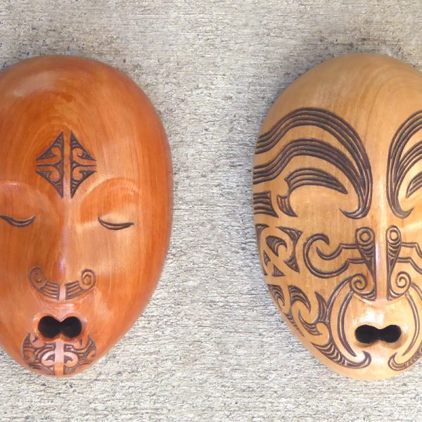Carved wood masks with maori tattoo/moko by Thomas Hansen